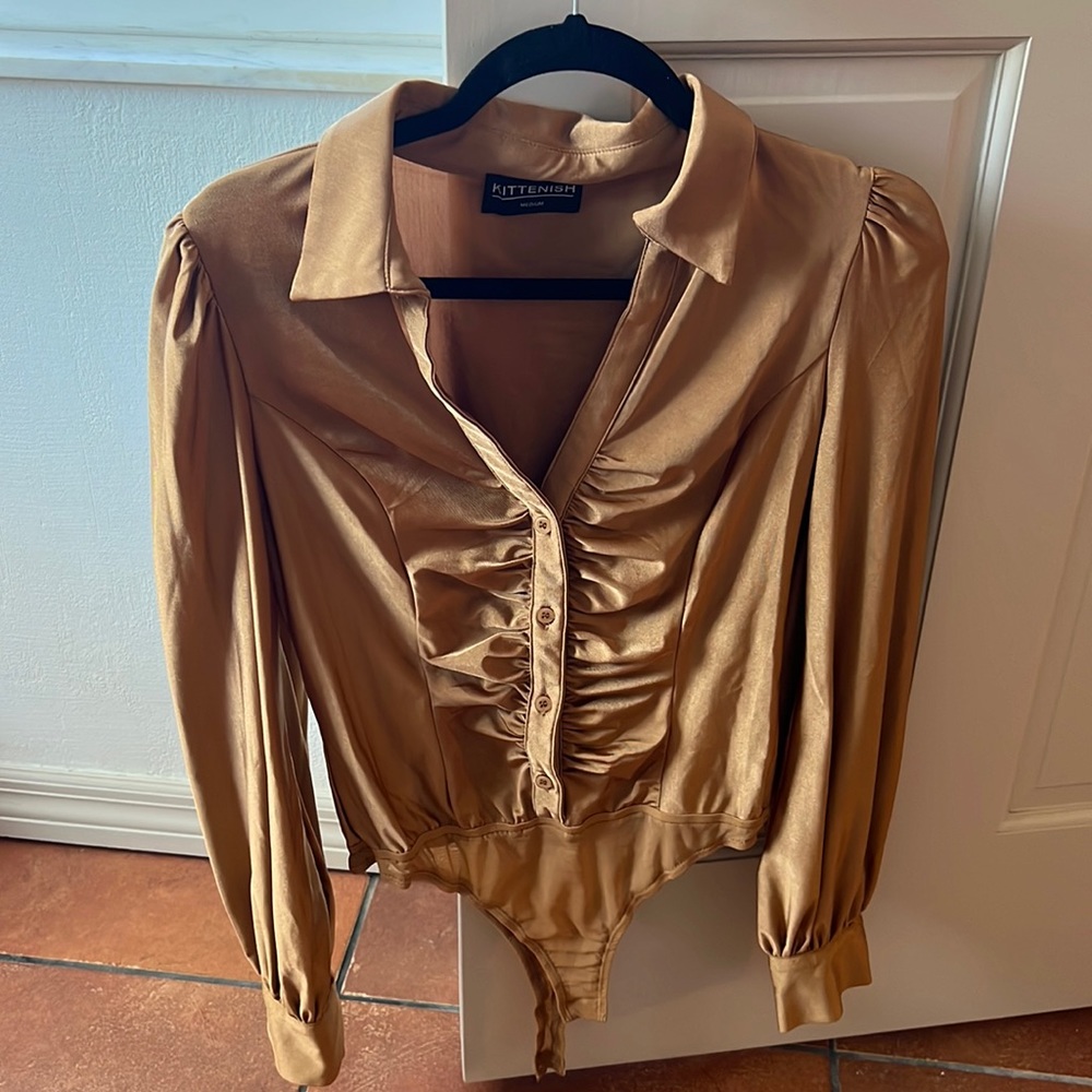 Kittenish button down body suit